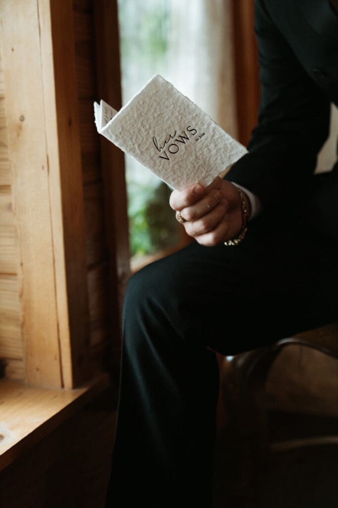 Detail of vow book held by Groom